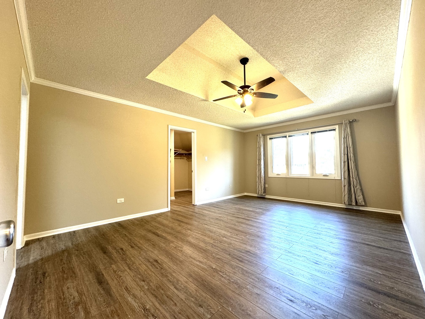 1398 East Gartner Road Naperville, IL 60540 - Photo 20 of 31 an empty room with wooden floor and windows
