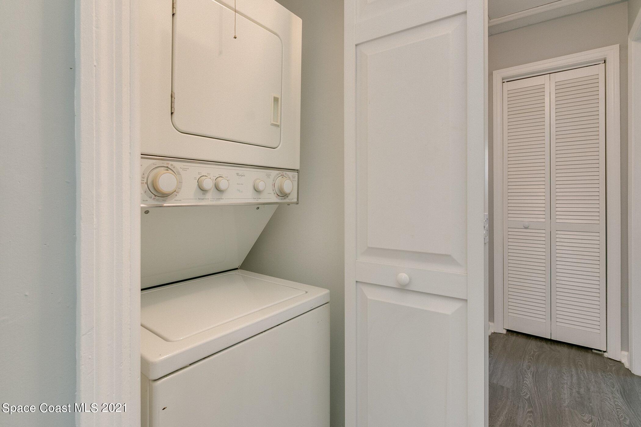 1589 Magnolia Street Northeast Palm Bay, FL 32905 - Photo 13 of 16 a utility room with dryer and washer
