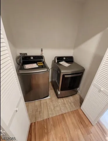 a utility room with washer and dryer