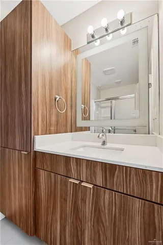 a bathroom with a sink and a mirror