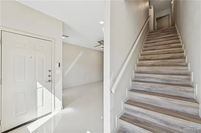 a view of staircase with white walls and white walls