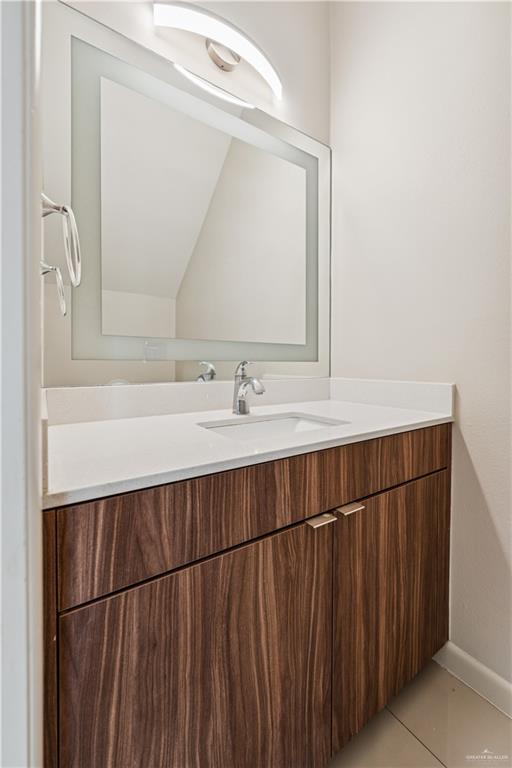 1201 East Olympia Avenue, Unit 2 McAllen, TX 78503 - Photo 10 of 15 a bathroom with a sink and a mirror