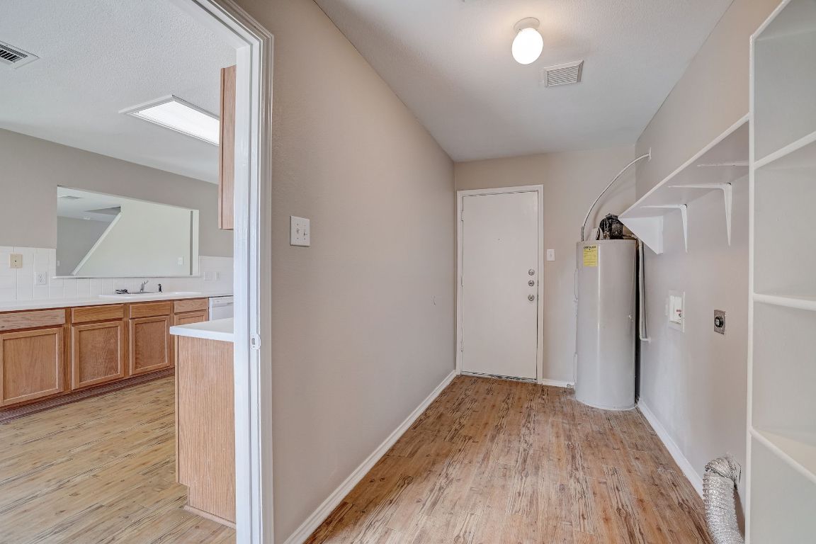 314 Bello Drive Leander, TX 78641 - Photo 16 of 35 a view of a kitchen from the hallway