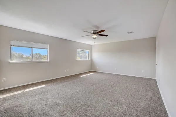 a view of an empty room with a window