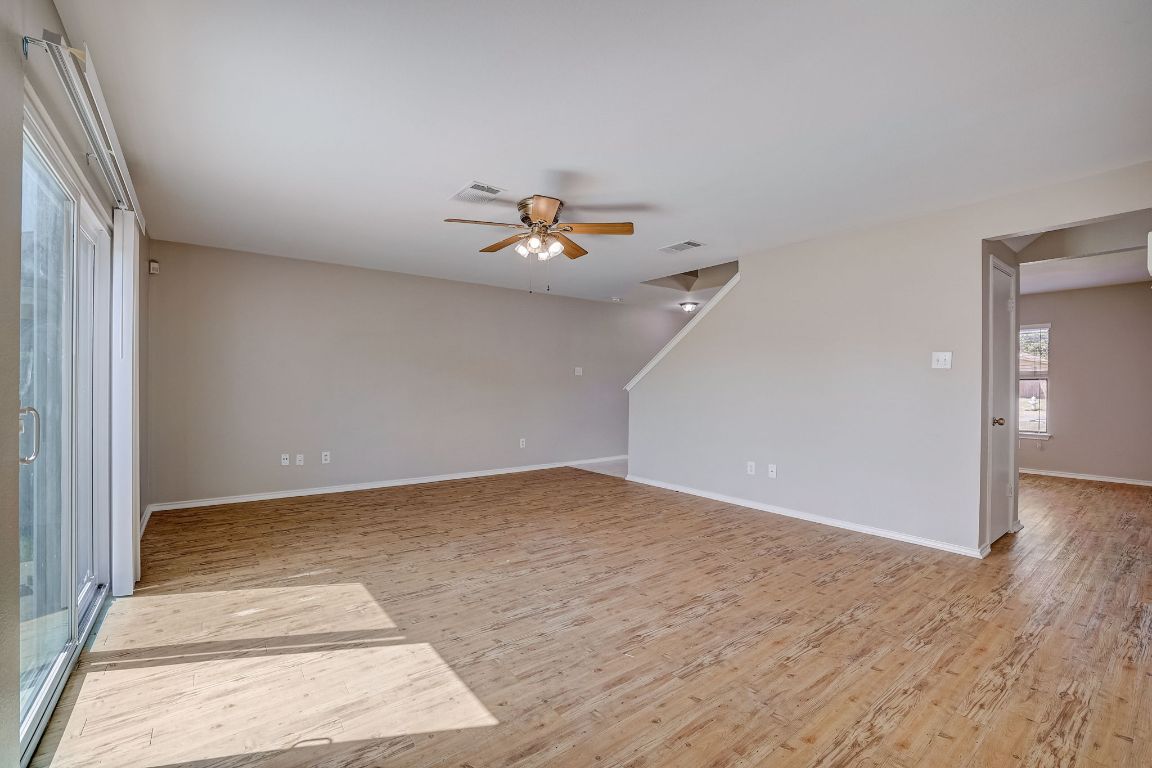 314 Bello Drive Leander, TX 78641 - Photo 7 of 35 a view of a room with an empty space and wooden floor