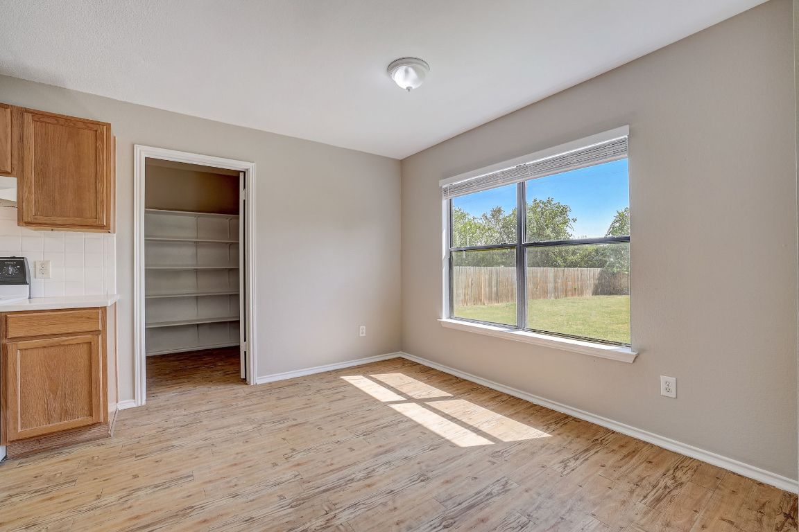 314 Bello Drive Leander, TX 78641 - Photo 9 of 35 an empty room with a window and a dresser