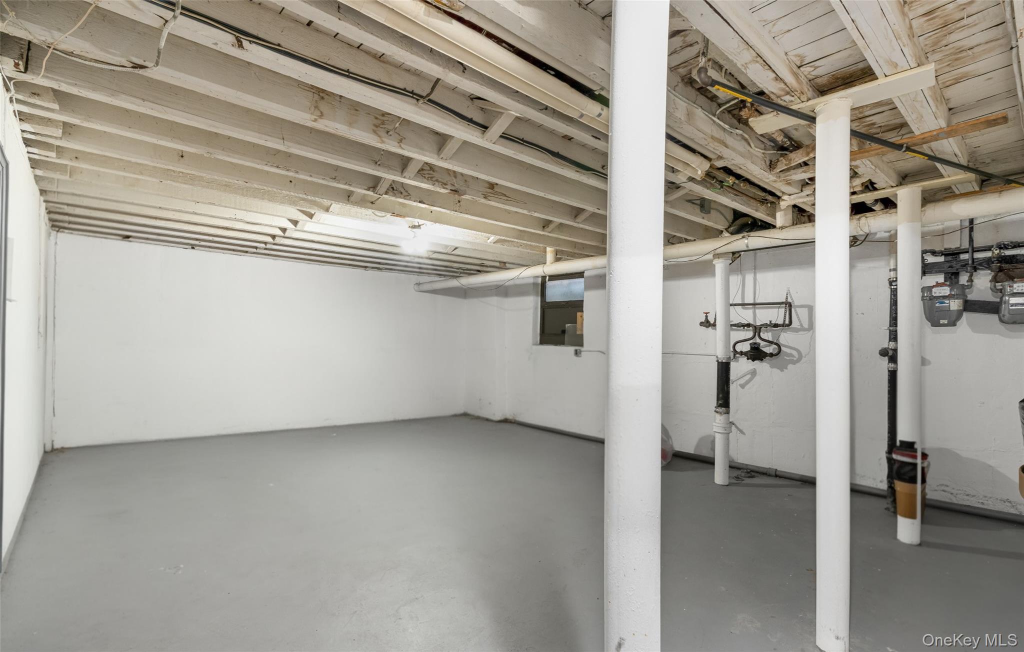 19-50 80th Street, Unit 1 Queens, NY 11370 - Photo 15 of 20 a view of a room with a utility room