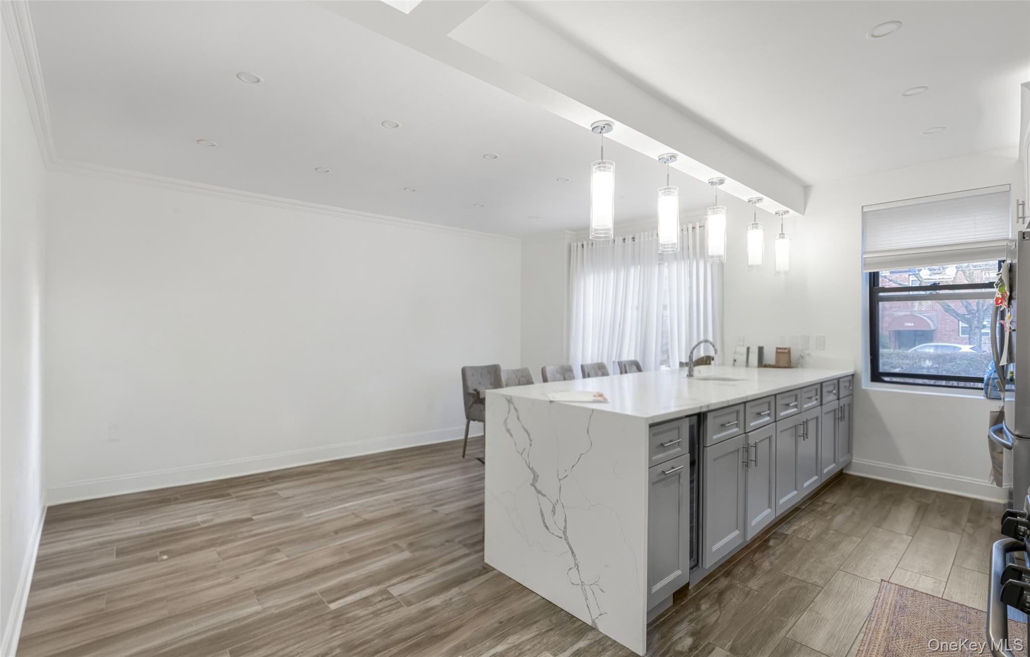 19-50 80th Street, Unit 1 Queens, NY 11370 - Photo 9 of 20 a bathroom with a sink mirror and a bathtub