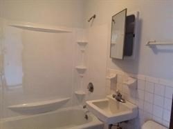 5 Turnpike Road, Unit 335 Townsend, MA 01469 - Photo 4 of 8 a bathroom with a shower and a sink