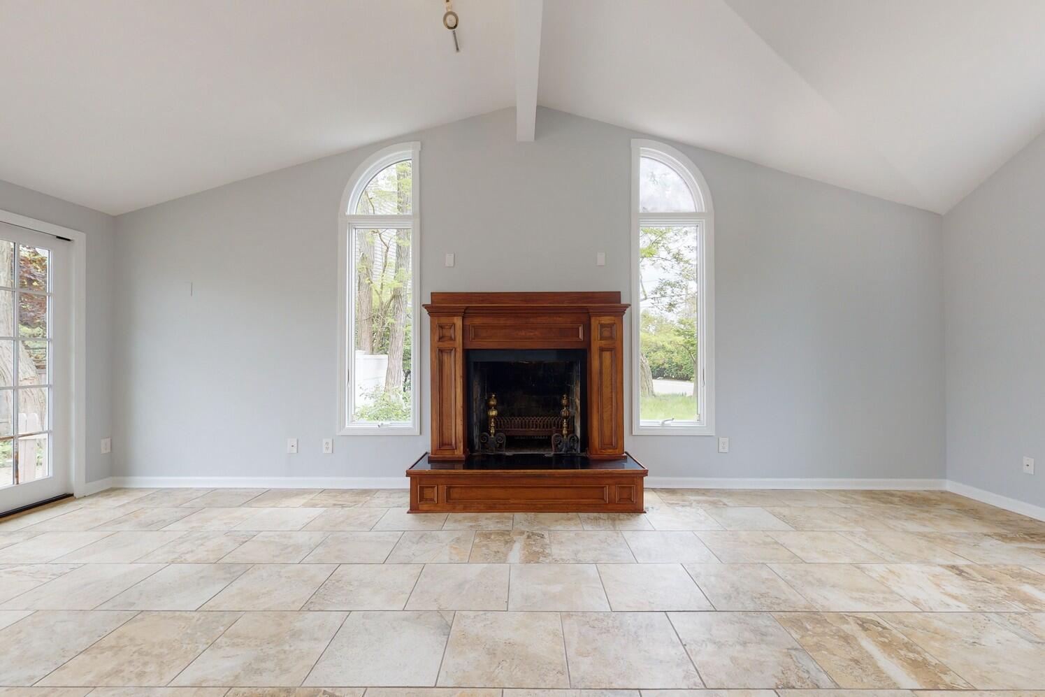 85 Roton Avenue Rowayton, CT 06853 - Photo 15 of 31 a living room with a fireplace