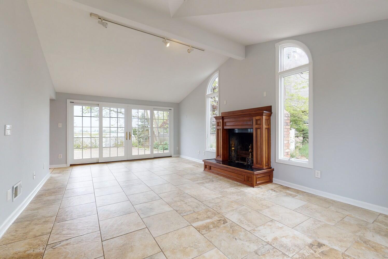 85 Roton Avenue Rowayton, CT 06853 - Photo 16 of 31 a view of an empty room with a fireplace and a window