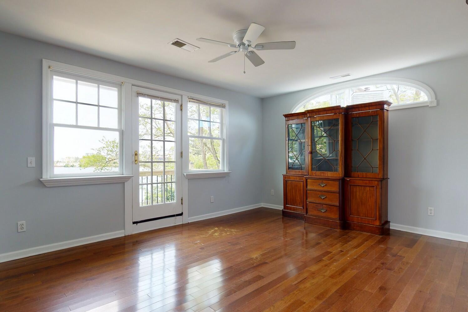 85 Roton Avenue Rowayton, CT 06853 - Photo 18 of 31 an empty room with windows and ceiling fan
