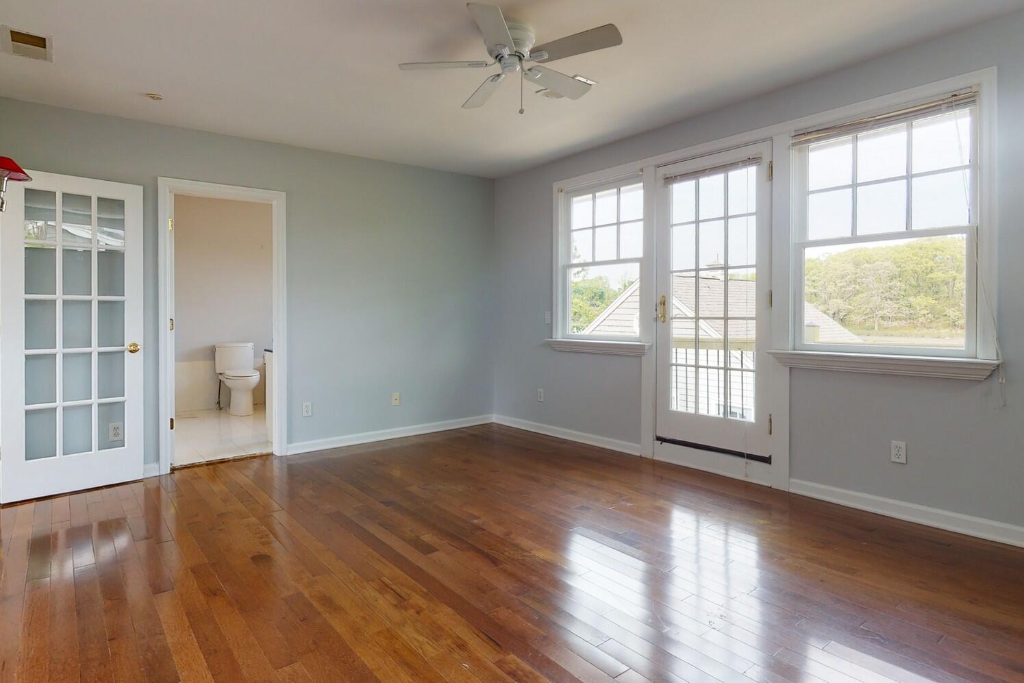 85 Roton Avenue Rowayton, CT 06853 - Photo 19 of 31 a view of an empty room with wooden floor and a window