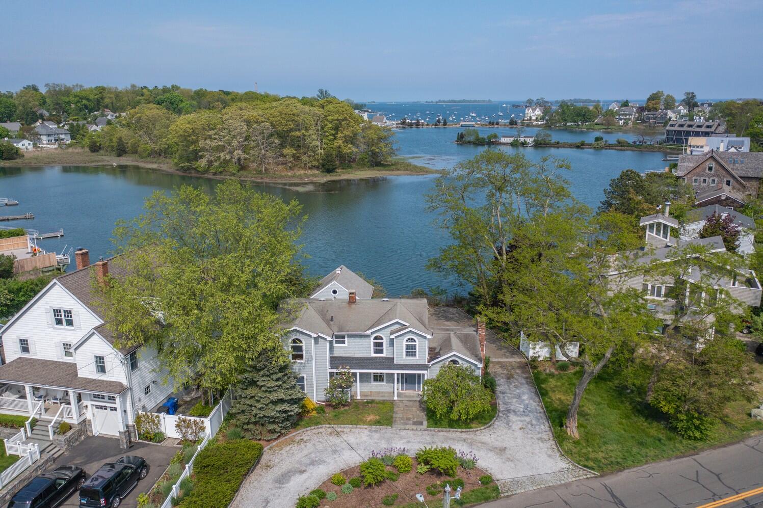 85 Roton Avenue Rowayton, CT 06853 - Photo 2 of 31 an aerial view of a house with a lake view