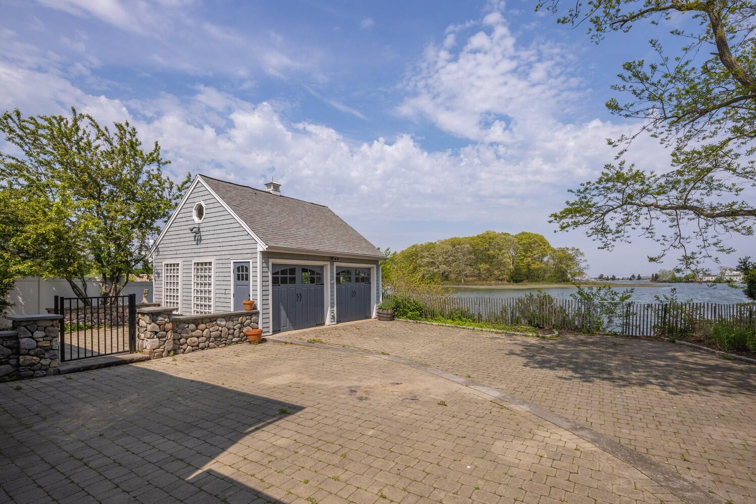 85 Roton Avenue Rowayton, CT 06853 - Photo 29 of 31 a view of a house with a yard