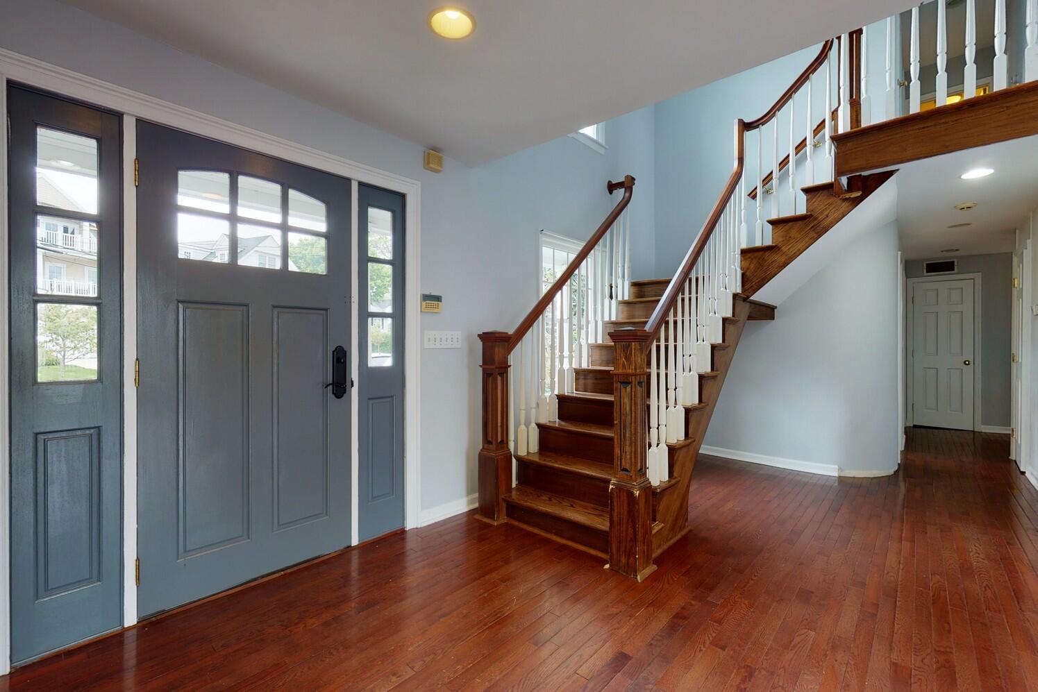 85 Roton Avenue Rowayton, CT 06853 - Photo 7 of 31 a view of entryway with wooden floor and stairs