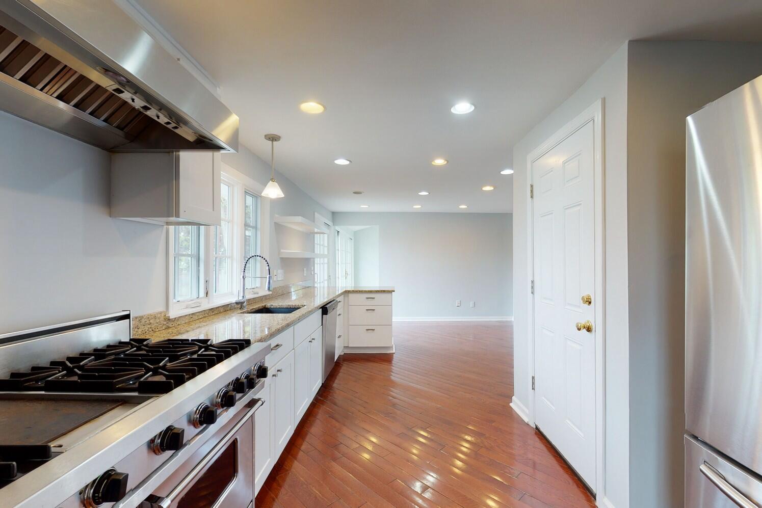 85 Roton Avenue Rowayton, CT 06853 - Photo 9 of 31 a kitchen with stainless steel appliances a sink and a stove