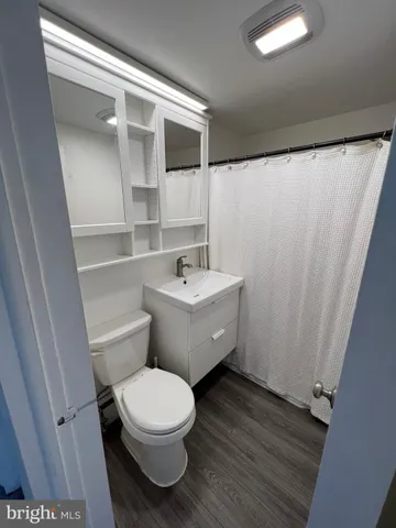 a bathroom with a toilet and a sink