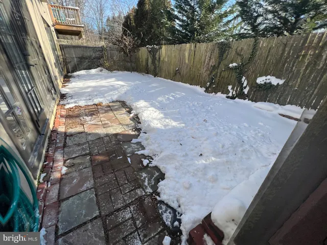a backyard of a house with barbeque oven fire pit and outdoor seating