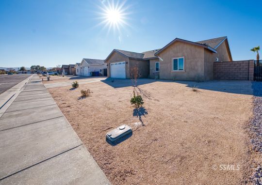 327 Abigail Street Ridgecrest, CA 93555 - Photo 3 of 35 a view of a house with a patio