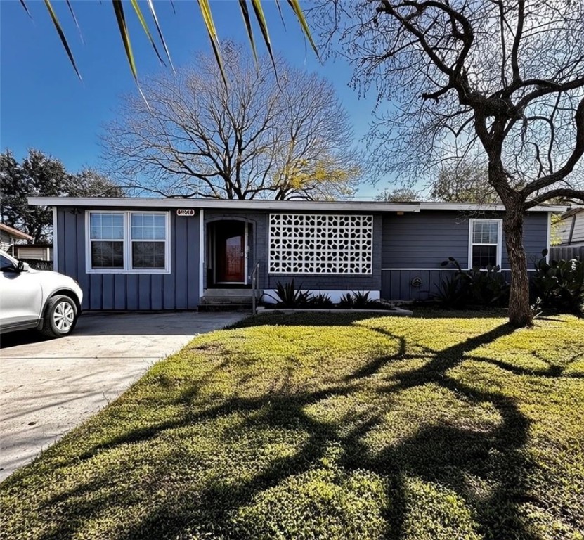 906 Rickey Drive Corpus Christi, TX 78412 - Photo 1 of 40 a front view of a house with a yard