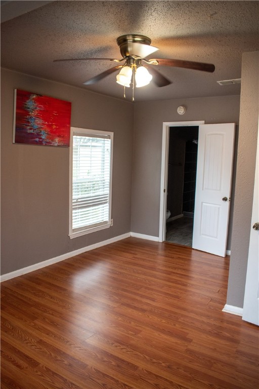 906 Rickey Drive Corpus Christi, TX 78412 - Photo 12 of 40 a view of an empty room with wooden floor and a window