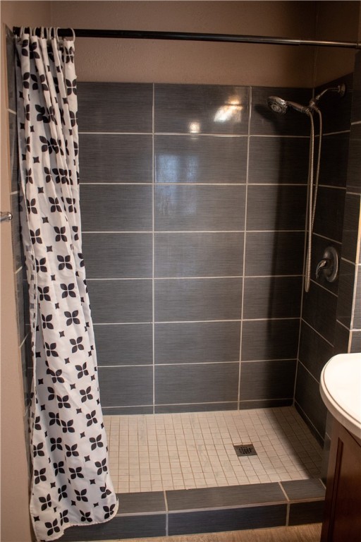 906 Rickey Drive Corpus Christi, TX 78412 - Photo 15 of 40 a bathroom with a sink a toilet a window and a shower