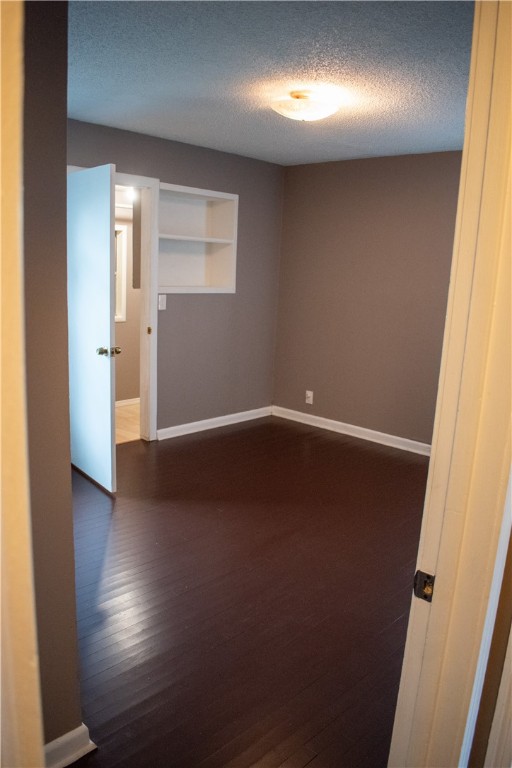 906 Rickey Drive Corpus Christi, TX 78412 - Photo 17 of 40 an empty room with wooden floor and windows in a room