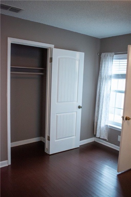 906 Rickey Drive Corpus Christi, TX 78412 - Photo 18 of 40 an empty room with wooden floor cabinet and windows