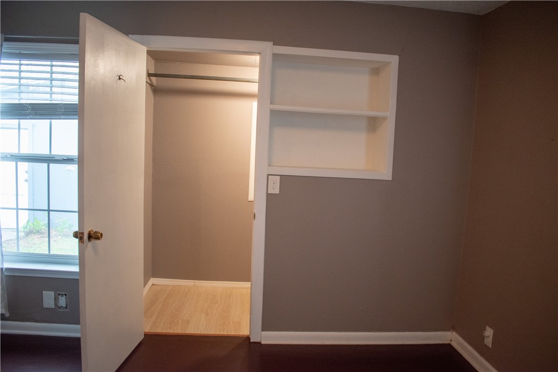 906 Rickey Drive Corpus Christi, TX 78412 - Photo 19 of 40 a view of small space with wooden floor and a window