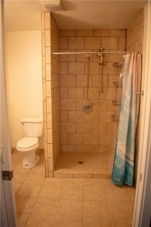 906 Rickey Drive Corpus Christi, TX 78412 - Photo 21 of 40 a bathroom with a shower and a toilet