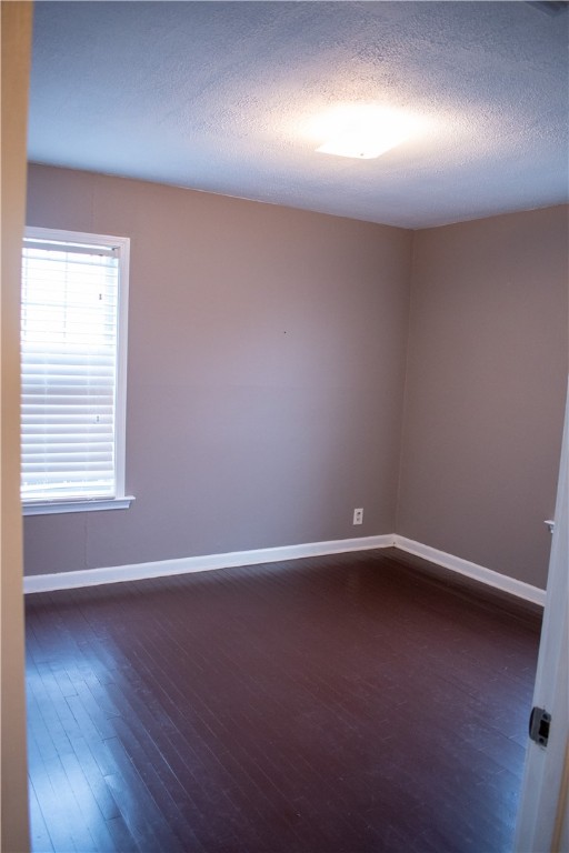 906 Rickey Drive Corpus Christi, TX 78412 - Photo 24 of 40 an empty room with wooden floor and windows
