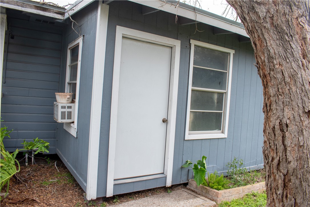 906 Rickey Drive Corpus Christi, TX 78412 - Photo 25 of 40 a view of front door and potted plants