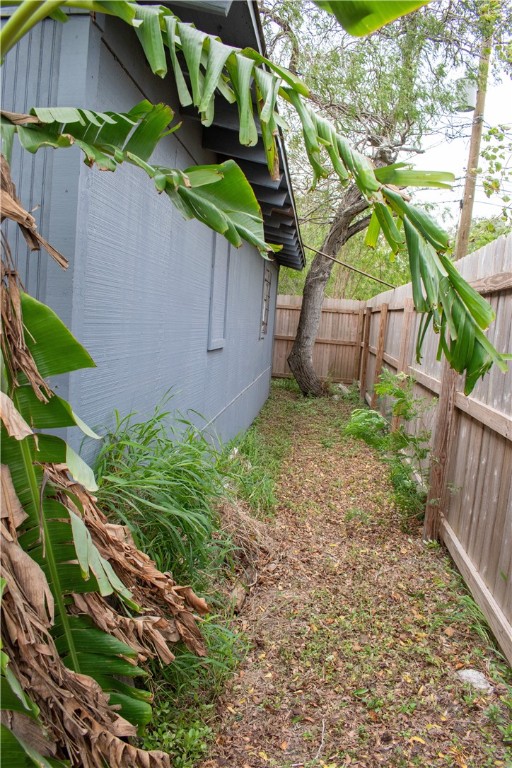 906 Rickey Drive Corpus Christi, TX 78412 - Photo 37 of 40 a backyard of a house with a garden and plants
