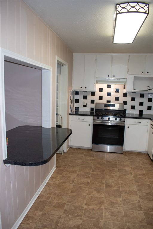 906 Rickey Drive Corpus Christi, TX 78412 - Photo 8 of 40 a kitchen with stainless steel appliances granite countertop a sink a stove and a refrigerator