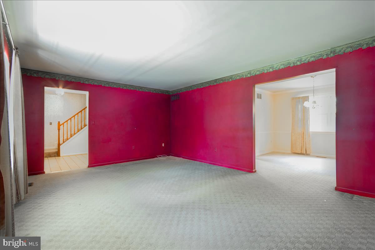 1368 Old Water Oak Point Road Pasadena, MD 21122 - Photo 6 of 30 Living Room leading into Formal Dining