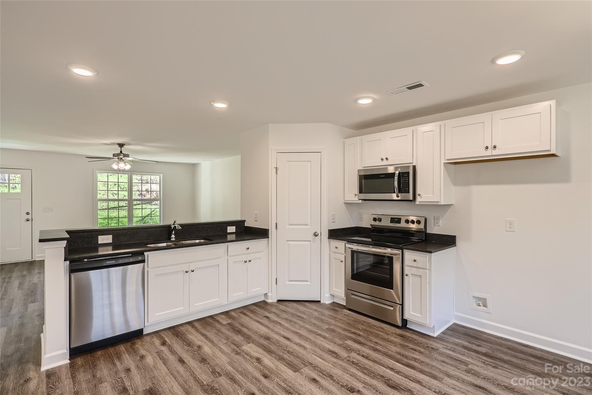 1 Hampton Church Road Charlotte, NC 28262 - Photo 3 of 11 a kitchen with stainless steel appliances a sink stove and refrigerator