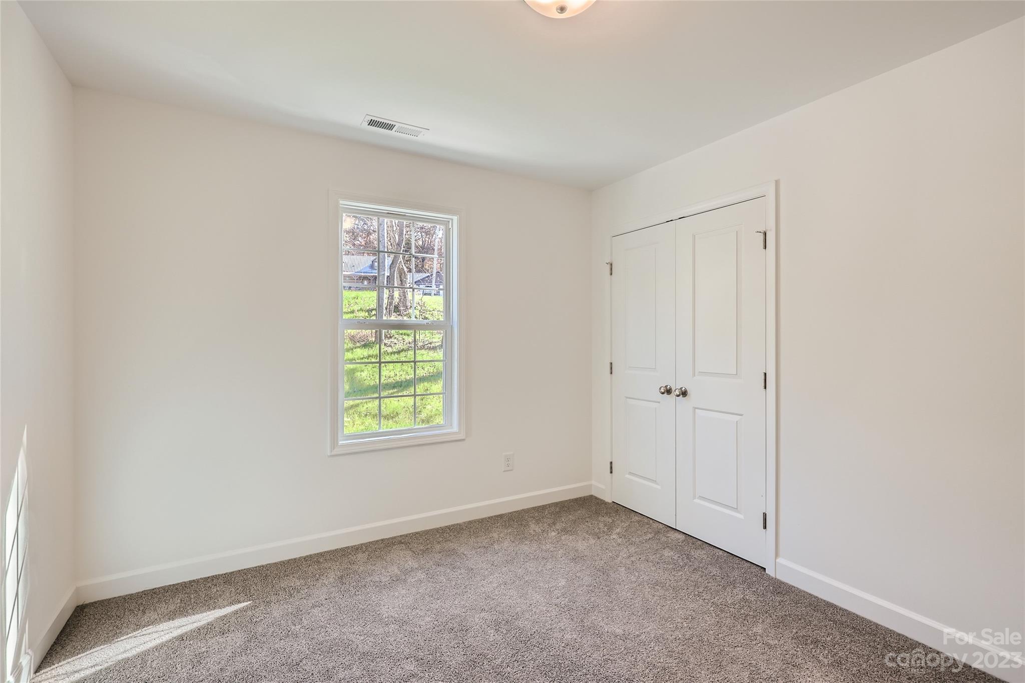 1 Hampton Church Road Charlotte, NC 28262 - Photo 9 of 11 a view of an empty room with a window