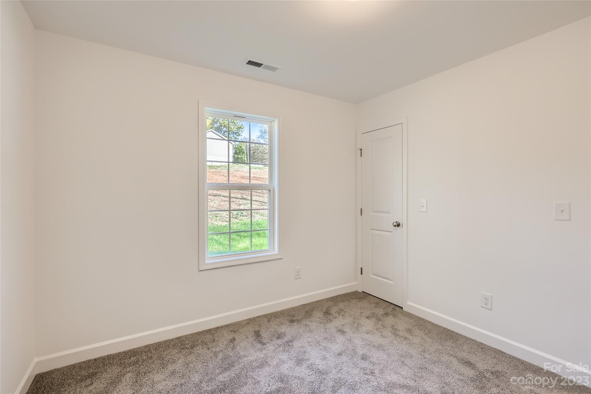 1 Hampton Church Road Charlotte, NC 28262 - Photo 10 of 11 an empty room with a window