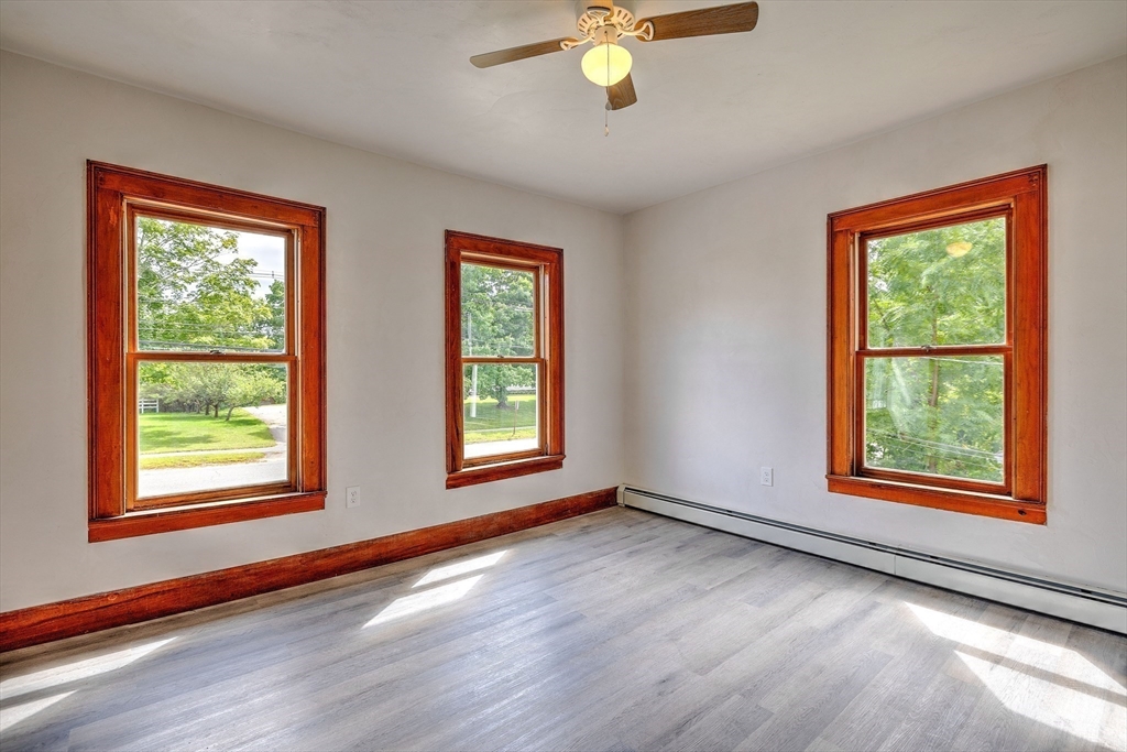 67-69 Petersham Road Hardwick, MA 01037 - Photo 13 of 38 a view of an empty room with a window and wooden floor