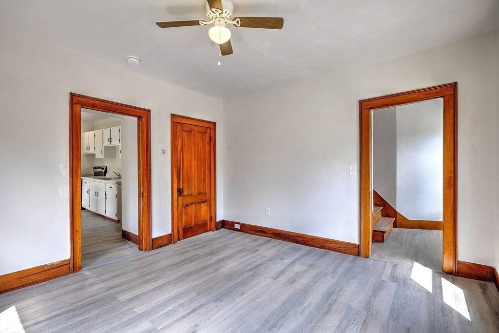 67-69 Petersham Road Hardwick, MA 01037 - Photo 14 of 38 a view of an empty room with wooden floor and a window