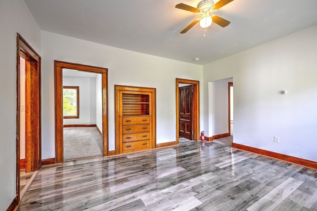67-69 Petersham Road Hardwick, MA 01037 - Photo 8 of 38 a view of an empty room with window and wooden floor