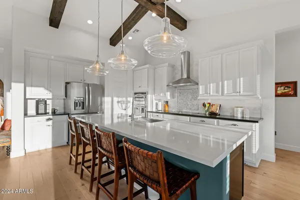 a living room with furniture a fireplace and a table