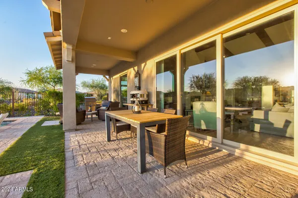 an aerial view of a house with a mountain