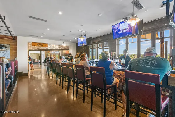 a front view of a house with yard and a garage