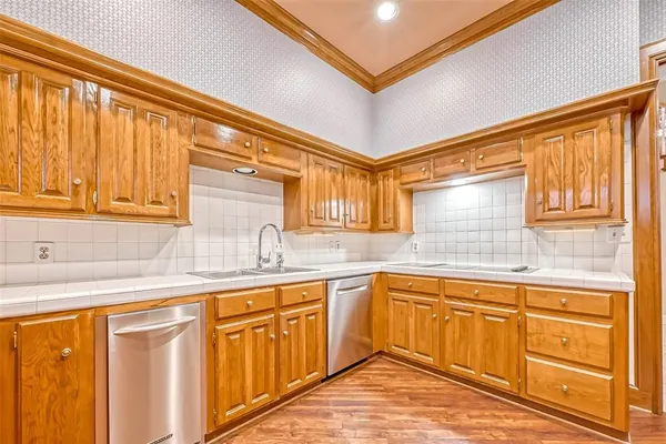 a kitchen with sink cabinets and window