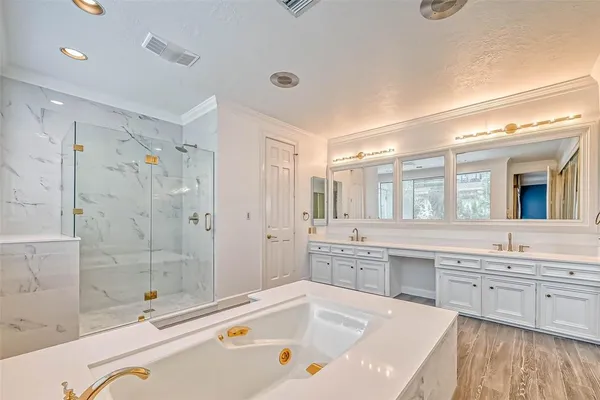 a bathroom with a double vanity sink and mirror