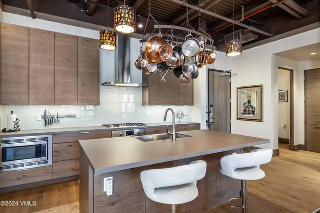 a kitchen with a table and chairs in it
