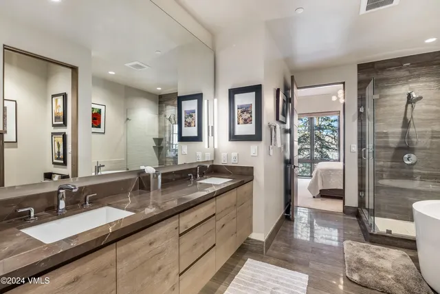 a bathroom with sinks double vanity and a granite counter tops