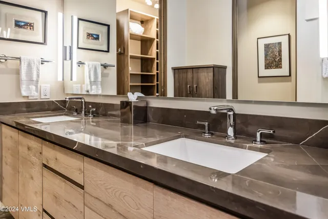 a bathroom with a white bath tub and shower
